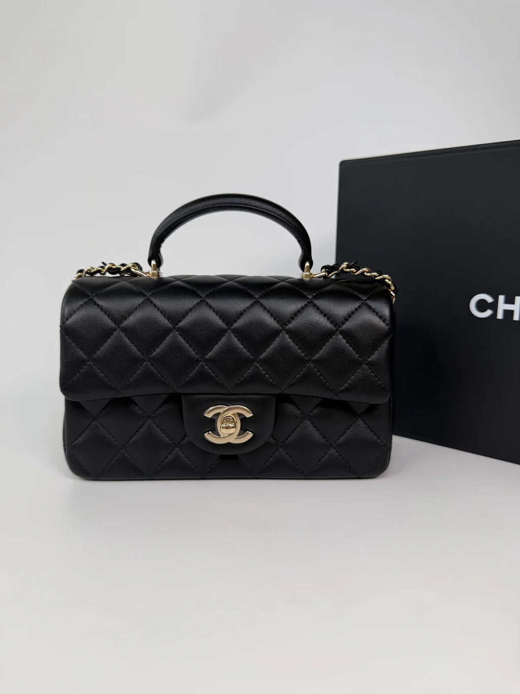 CHANEL MINI RECTANGLE TOP HANDLE IN BLACK LAMBSKIN LEATHER WITH PALE GOLD HARDWARE