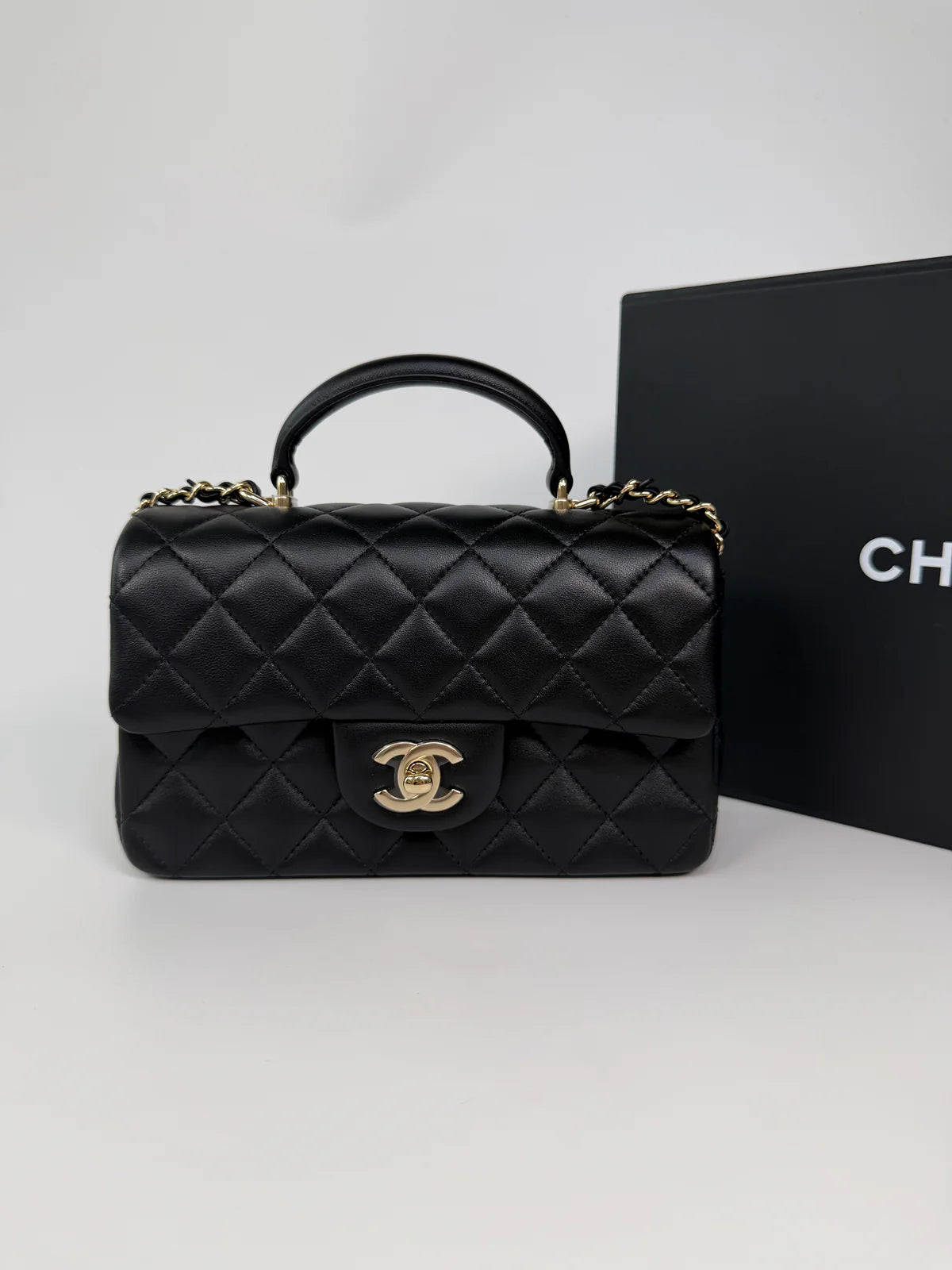CHANEL MINI RECTANGLE TOP HANDLE IN BLACK LAMBSKIN LEATHER WITH PALE GOLD HARDWARE