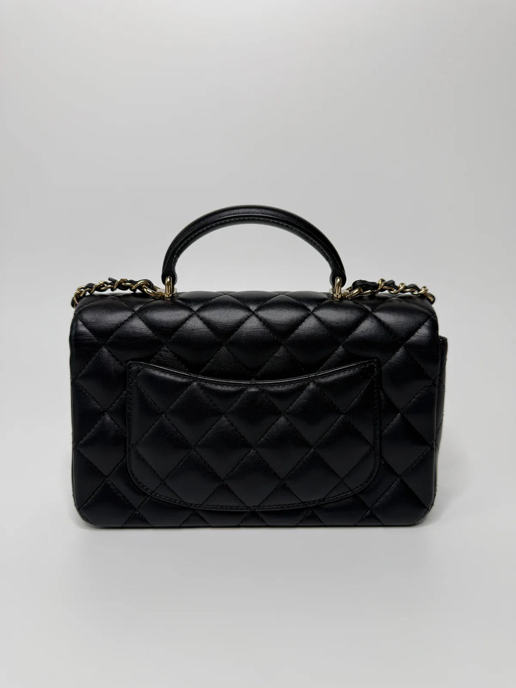 CHANEL MINI RECTANGLE TOP HANDLE FLAP BAG IN BLACK LAMBSKIN WITH PALE GOLD HARDWARE