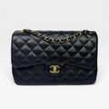 CHANEL BLACK LAMBSKIN LEATHER JUMBO CLASSIC DOUBLE FLAP GOLD HARDWARE
