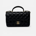 CHANEL MINI RECTANGLE TOP HANDLE FLAP BAG IN BLACK LAMBSKIN WITH PALE GOLD HARDWARE