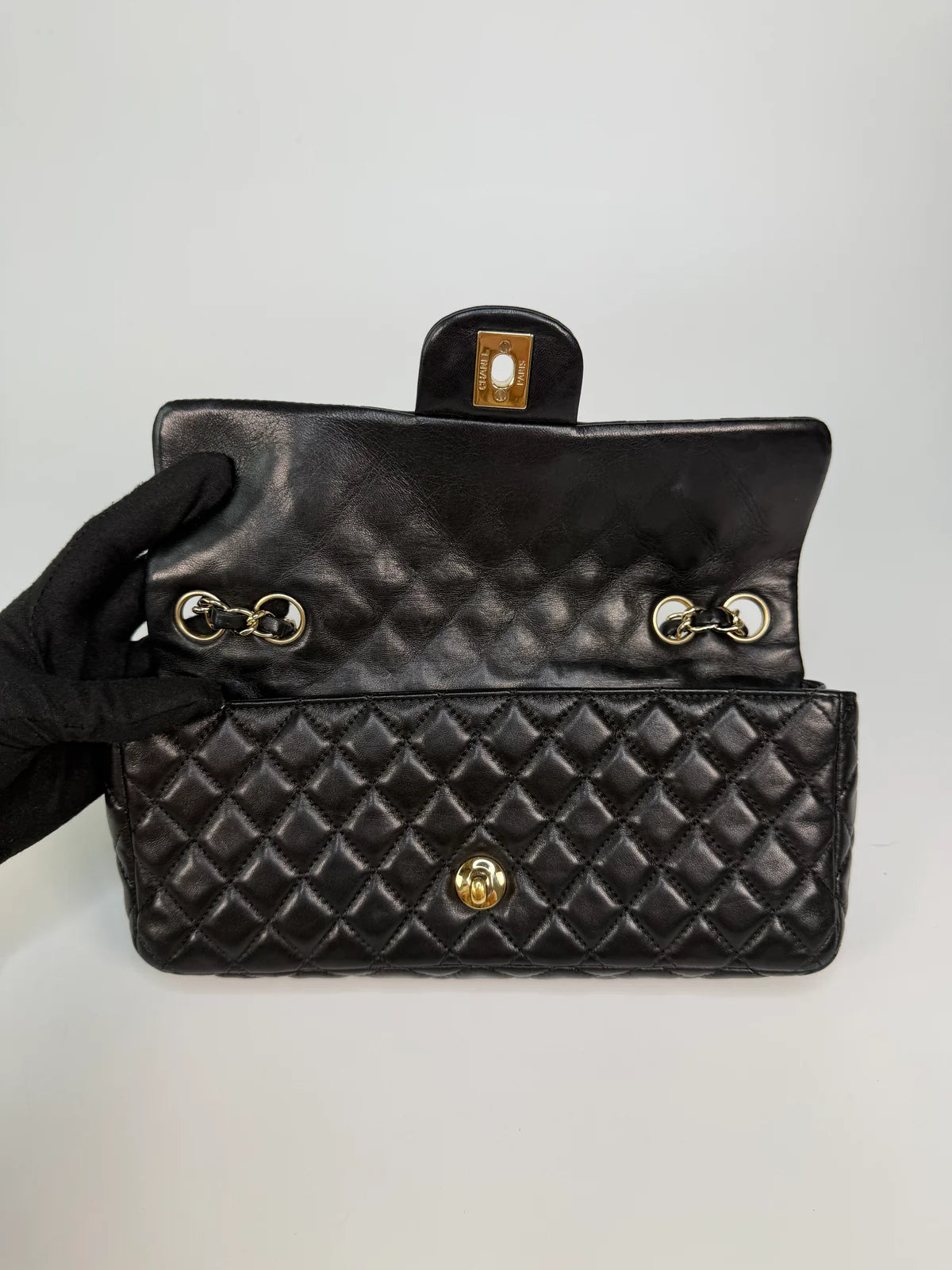 CHANEL EAST WEST CHARMS BAG IN BLACK LAMBSKIN LEATHER WITH GOLD HARDWARE