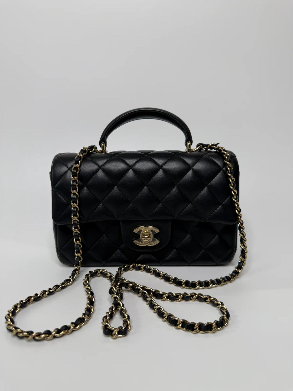 CHANEL MINI RECTANGLE TOP HANDLE FLAP BAG IN BLACK LAMBSKIN WITH PALE GOLD HARDWARE