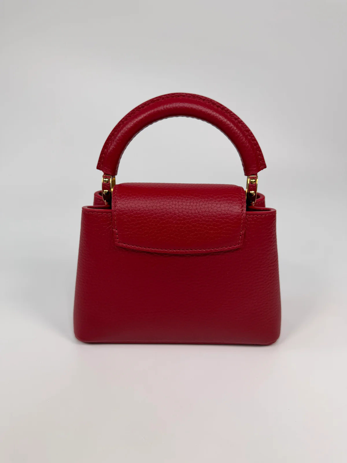 LOUIS VUITTON CAPUCINES MINI BAG IN SCARLET TAURILLION LEATHER WITH GOLD HARDWARE