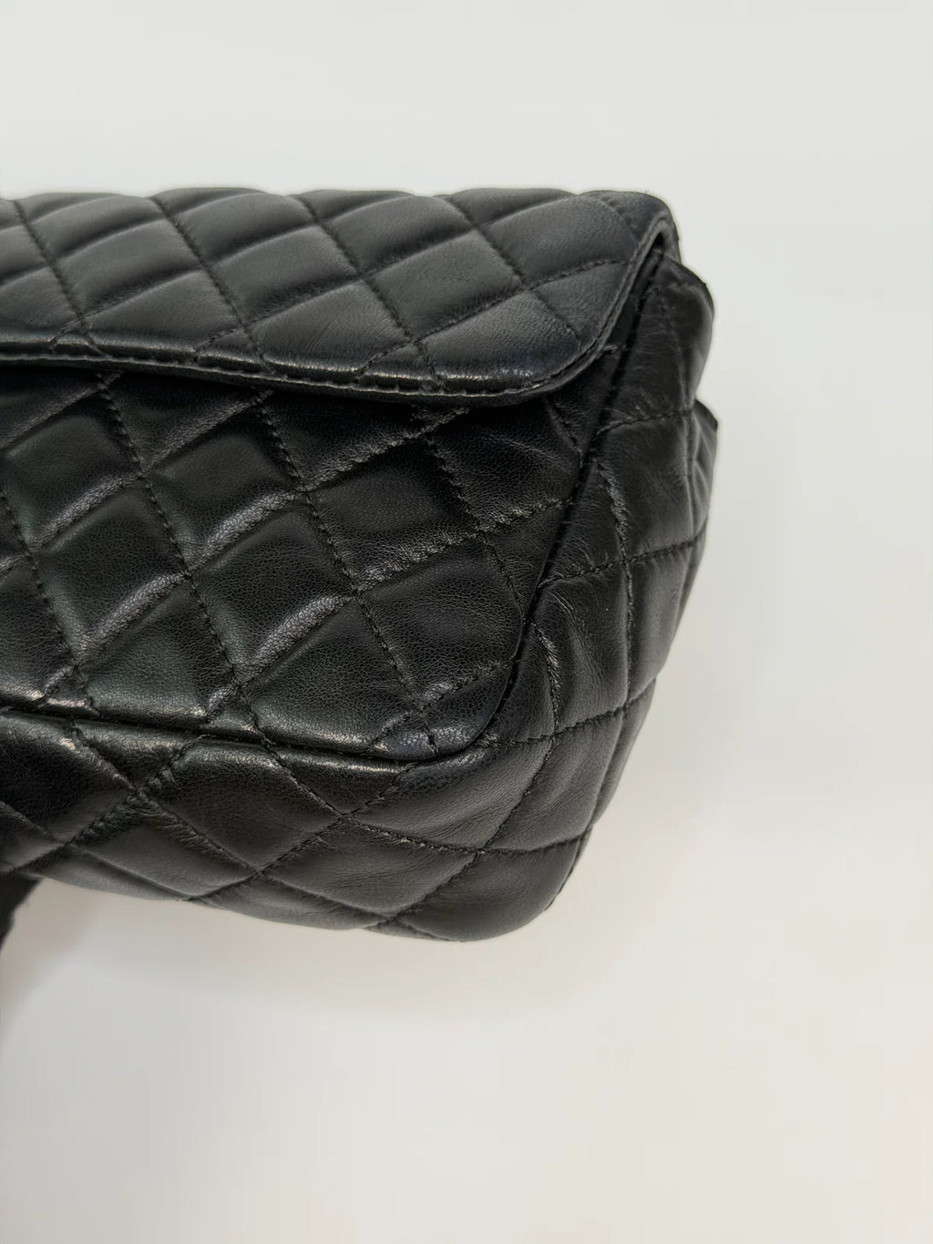 CHANEL EAST WEST CHARMS BAG IN BLACK LAMBSKIN LEATHER WITH GOLD HARDWARE