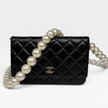 CHANEL PEARL WALLET ON CHAIN IN BLACK LAMBSKIN LEATHER WITH PALE GOLD HARDWARE