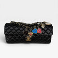 CHANEL EAST WEST CHARMS BAG IN BLACK LAMBSKIN LEATHER WITH GOLD HARDWARE
