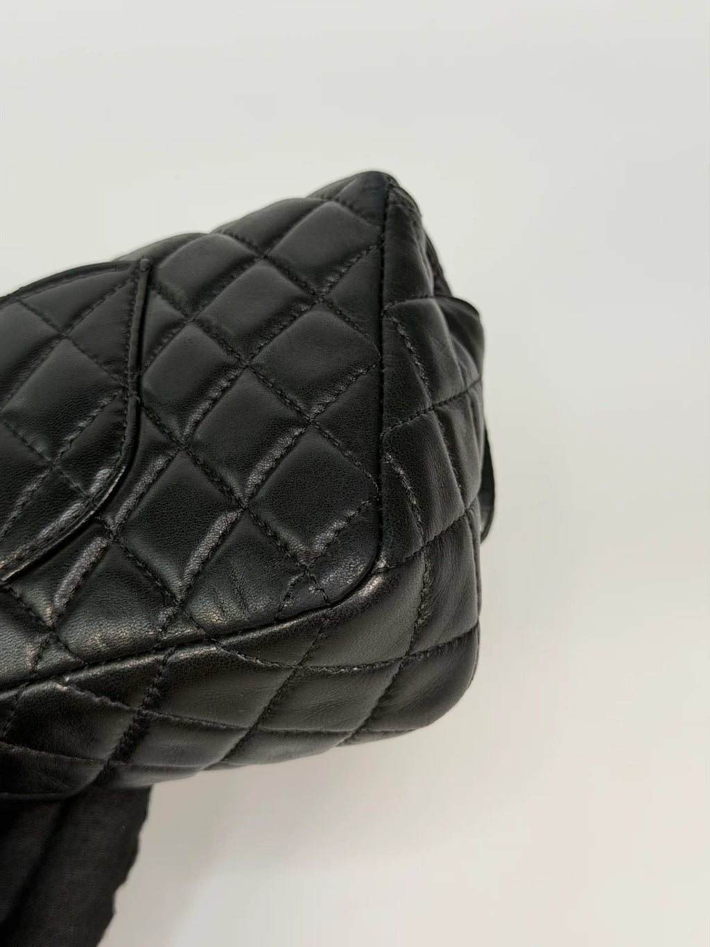 CHANEL EAST WEST CHARMS BAG IN BLACK LAMBSKIN LEATHER WITH GOLD HARDWARE