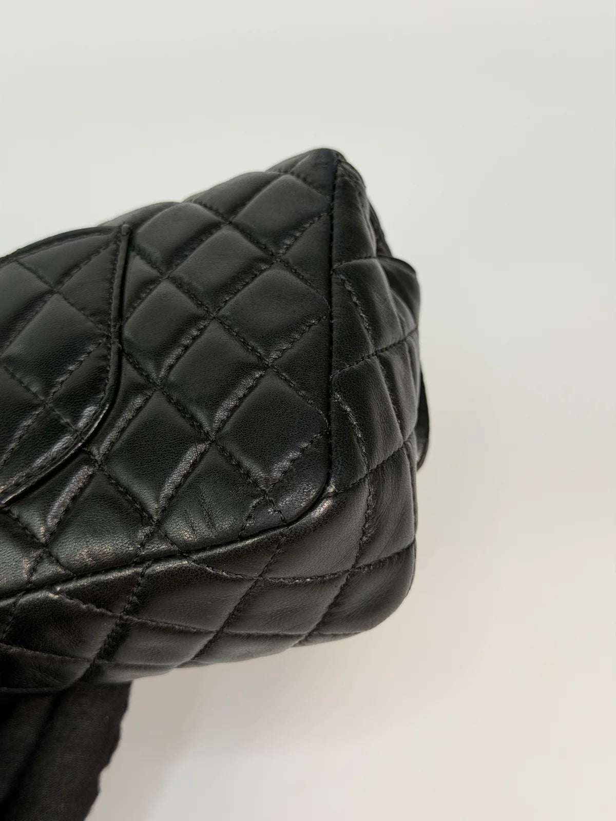 CHANEL EAST WEST CHARMS BAG IN BLACK LAMBSKIN LEATHER WITH GOLD HARDWARE