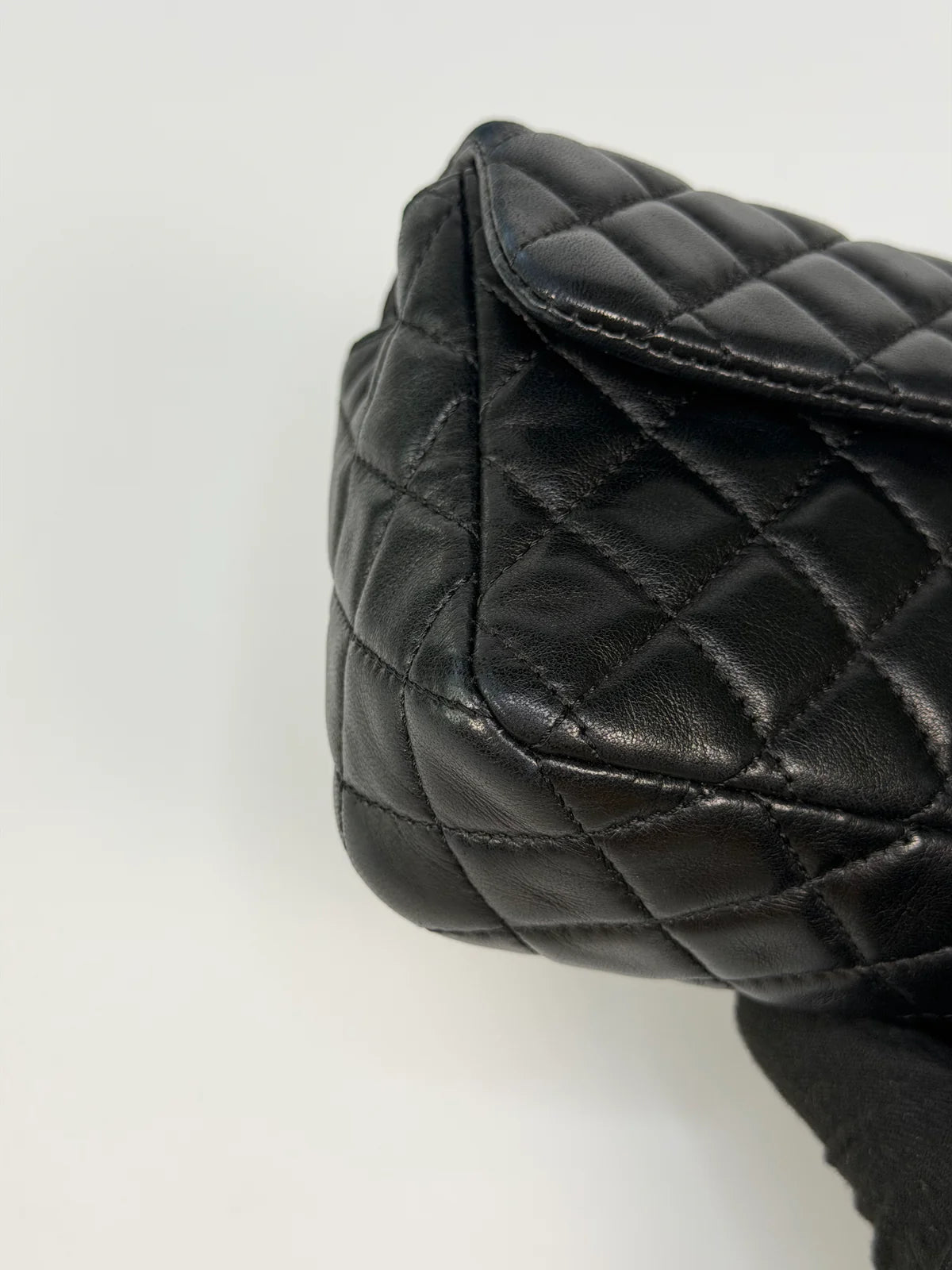 CHANEL EAST WEST CHARMS BAG IN BLACK LAMBSKIN LEATHER WITH GOLD HARDWARE
