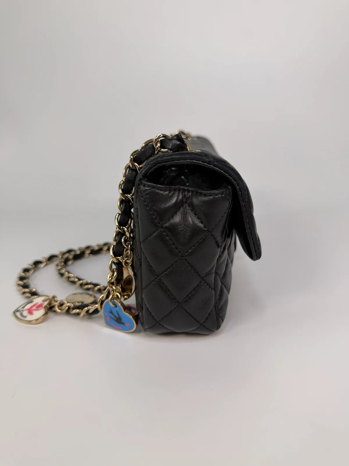 CHANEL EAST WEST CHARMS BAG IN BLACK LAMBSKIN LEATHER WITH GOLD HARDWARE