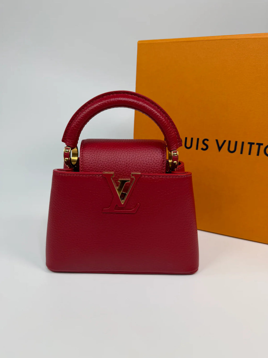 LOUIS VUITTON CAPUCINES MINI BAG IN SCARLET TAURILLION LEATHER WITH GOLD HARDWARE