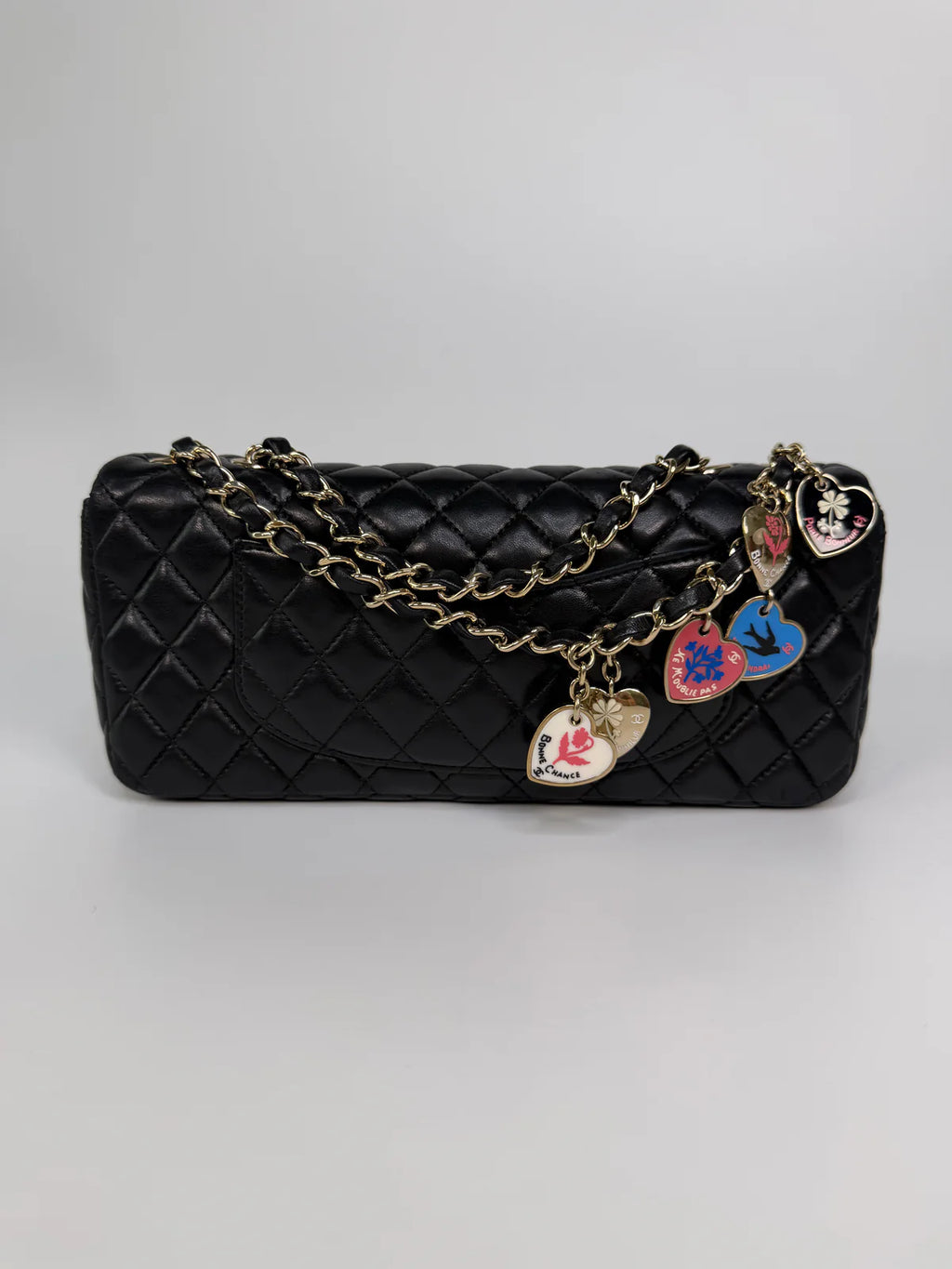 CHANEL EAST WEST CHARMS BAG IN BLACK LAMBSKIN LEATHER WITH GOLD HARDWARE