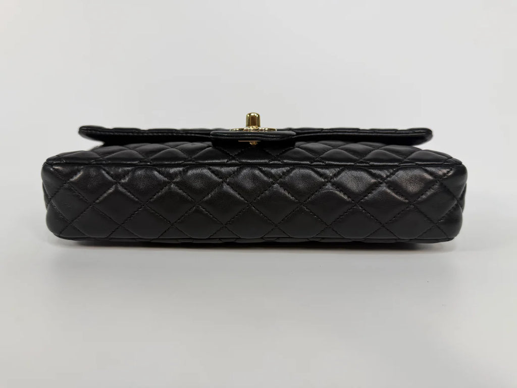 CHANEL EAST WEST CHARMS BAG IN BLACK LAMBSKIN LEATHER WITH GOLD HARDWARE